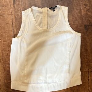 Express sleeveless cream color top with zipper.